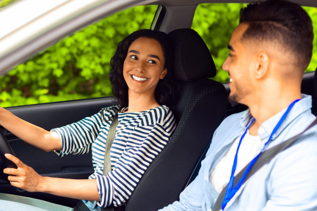 Woman in car symbolising car insurance and UK driving coverage